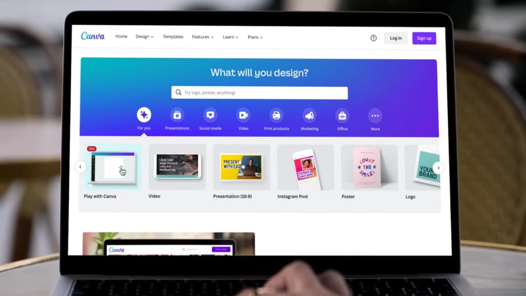 A laptop displaying Canva's homepage with design options